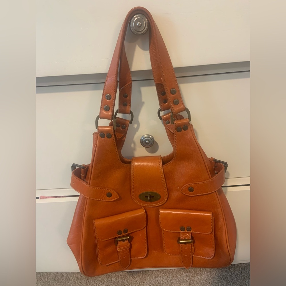 Orange Leather Shoulder Bag with Structured Design and Decorative Buckles